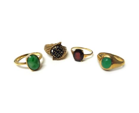 A 9ct gold and sapphire set seven stone cluster ring with fluted shoulders, a gold ring mounted with an oval jade, detailed 9