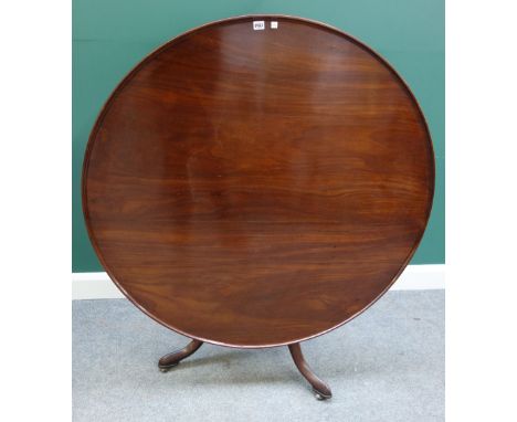 A large George III supper table, with dished circular snap top, on bird cage supports and tripod base, 120cm wide x 69cm high