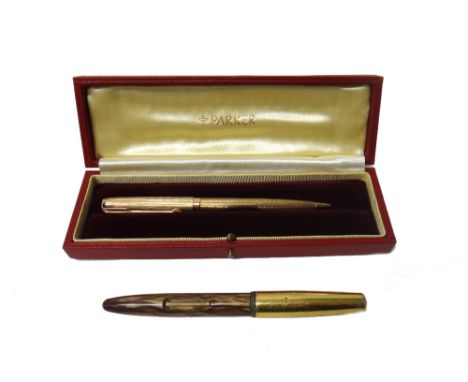 A 9ct gold cased Parker ballpoint pen, with engine turned decoration, with the original instructions and Parker case and a Pl