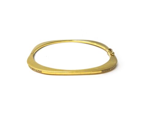 A gold and diamond set hinged bangle, the two front corners mounted with rows of small circular cut diamonds, on a snap clasp