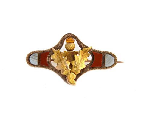A  9ct gold, jasper and banded grey agate set Scottish brooch, designed as a thistle within a shaped surround, by Joseph Cook