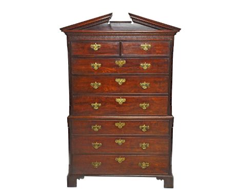 A George II mahogany chest on chest, with architectural cornice over two short and six long graduated drawers, on bracket fee