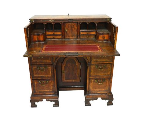 A George II walnut banded oak kneehole writing desk with fitted interior and ogee bracket feet, 93cm wide x 95cm high.  Illus