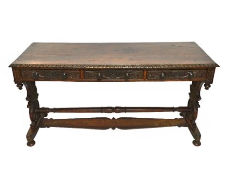 A 19th century Spanish carved rosewood three drawer side table, on trestle supports, 148cm wide x 76cm high.  Illustrated