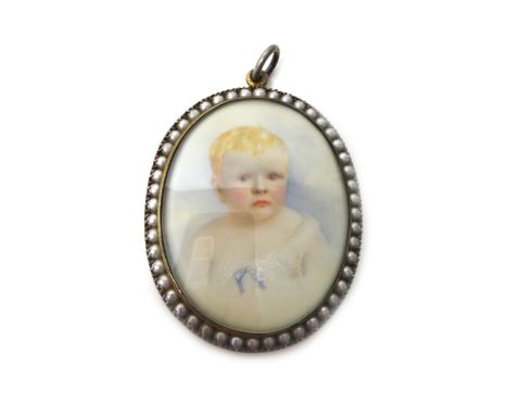 A Victorian gold mounted oval shell cameo brooch carved as a portrait of Medusa, the back glazed with an oval portrait miniat