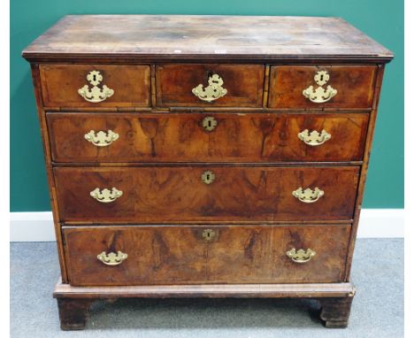 A George I walnut chest of three short and three long drawers, on bracket feet, 102cm wide x 101cm high.