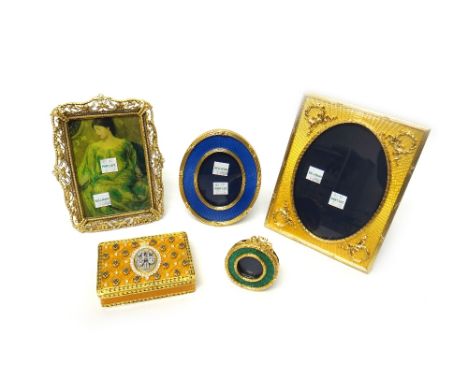 A gilt metal, yellow enamelled and colourless paste set rectangular box and cover, decorated with a cypher in the Russian sty