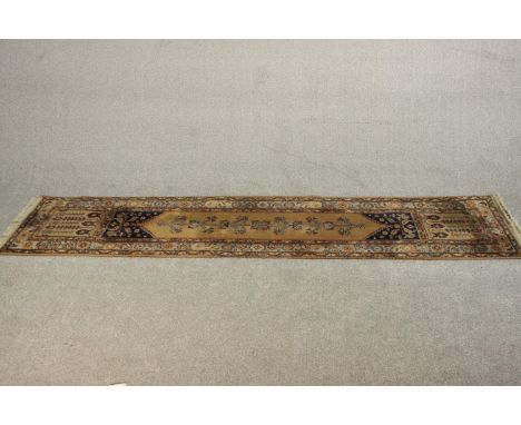 A gold ground Ardebil motif runner. L.258 W.65cm. 