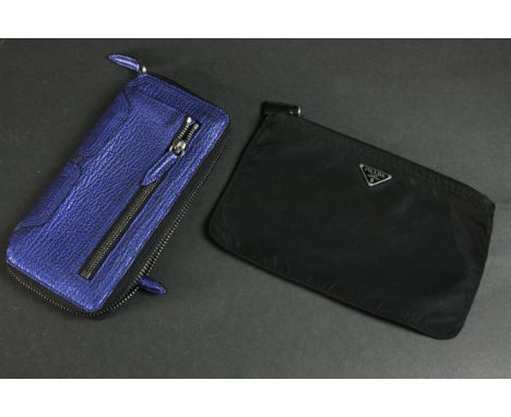 A vintage black silk Prada zip purse along with a Philip Lim metallic blue leather clutch bag. H.22 W.14cm. 