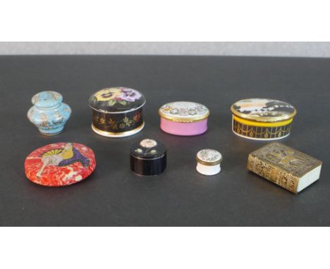 A collection of trinket boxes, including two Halcyon Days enamel boxes, a brass repousse match box holder and other items. H.