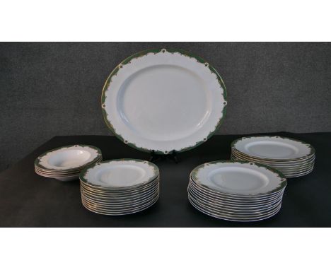 A Royal Worcester Connaught pattern hand painted part dinner service for twelve people. Makers mark to base. (28 Pieces) W.45