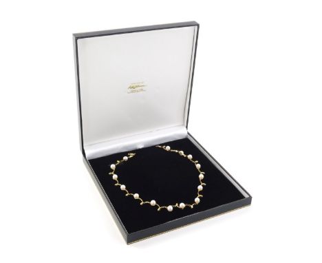 An 18ct gold diamond and pearl necklace, the arch point design set with diamond, with cultured pearl beads, 41cm long, marked