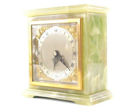 A 20thC Elliott mantel clock, with raised gilt cherub spandrels, 8cm diameter Roman numeric chapter ring, in an onyx case, 14
