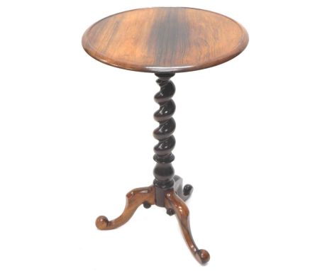 A 19thC rosewood occasional table, the circular dished top on a spirally turned column and tripod base, 47cm diameter.