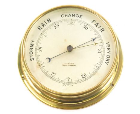 A brass cased bulk head style wall barometer, of circular form, the 19cm Arabic dial marked JF Hunt, Hull and Scarborough.
