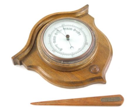 An early 20thC oak cased wall barometer, with shield back, and a teak letter opener, made from the wood of HMS Warspite with 