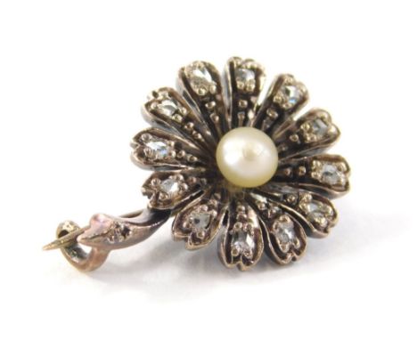 A diamond and pearl set brooch, with petal set rose cut diamonds, and central cultured pearl in a white gold overall finish b