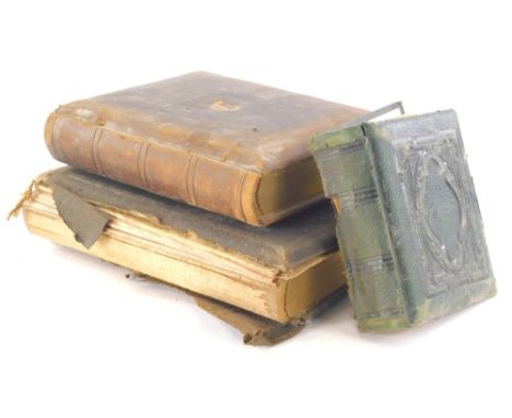 Three various Victorian photograph albums, to include one in green textured leather, 16cm high, some containing photographs, 