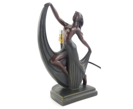 An Art Deco style table lamp, in the form of a semi clad dancing lady, in flowing skirt on D shaped base, with electrical fit