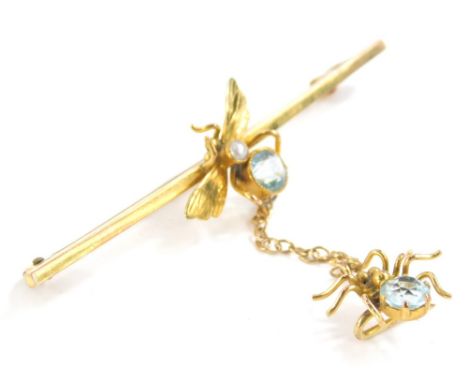 A spider and bug bar brooch, the bar set with fly emblem, set with cultured pearl and a circular faceted cut blue stone, with