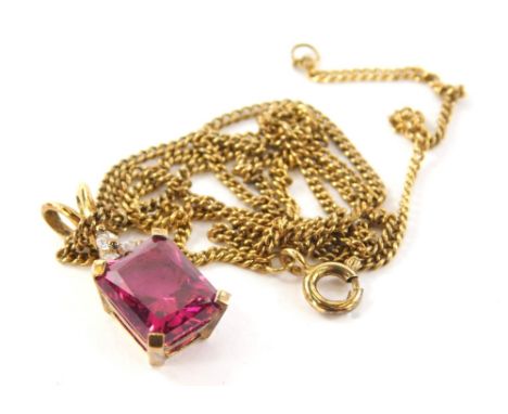 A silver pendant and chain, the silver fine link chain with gold coloured finish, with associated pendant set with paste ston
