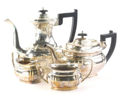 An early 20thC silver plated tea and coffee set, by Mappin and Webb, the teapot of cape form with ebonised angular handle and