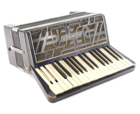 A mid 20thC Hohner Verdi piano accordion, with five rows of buttons in black trim, 42cm wide.