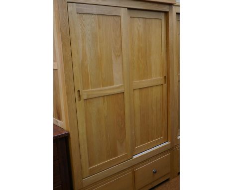 Very good quality light oak double wardrobe with drawers. Must be picked up by 10am Thursday or automatic storage charges wil