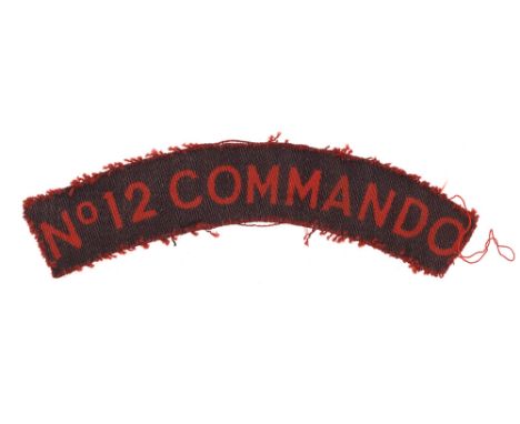 No.12 COMMANDO WW2 Ordnance issued printed cloth shoulder title badge circa 1942-43. Good scarce red sans-serif letters on da