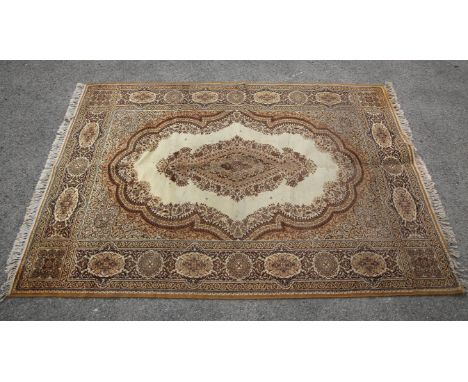 Indian carpet, the ivory ground with scrolling medallion and spandrels within a panelled border, 200 x 304 cm and a Bidjar st