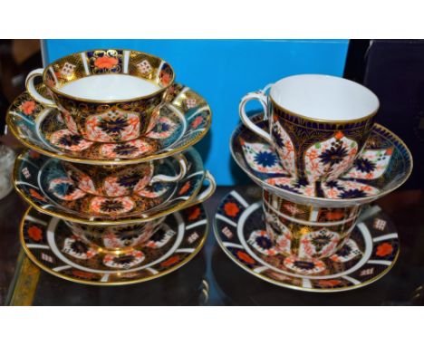 A pair of early 20th century Royal Crown Derby 1128 pattern shallow cups and saucers; a late 19th century 2731 pattern Imari 