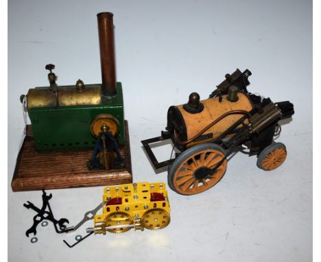 A stationary steam engine; a working model of a rocket (a/f); Meccano gears (3)
