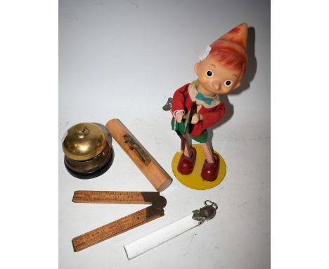 A brass desk/shop bell, early 20th century; a novelty perspex and plated mouse rule; a Mauchline ware pencil case; a vintage 