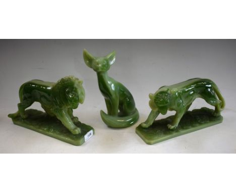 An Italian jade effect resin model of a fox, marked G. Ruggeri, 23.5cm high; others, similar, tiger and lion, 30cm wide (3)