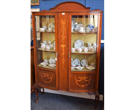 A Sheraton Revival mahogany and marquetry bow-front display cabinet, arched half gallery above a pair of three-quarter glazed