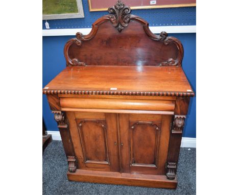 A Victorian mahogany chiffonier, rectangular top with shaped half gallery carved with scrolling acanthus, above a frieze draw