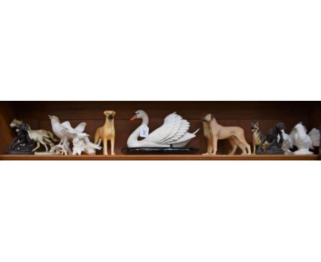 A Beswick model of a dog, Champion Ruler of Ouborough; a Franklin Mint model of a swan, 30cm wide, on oval base; other bird a