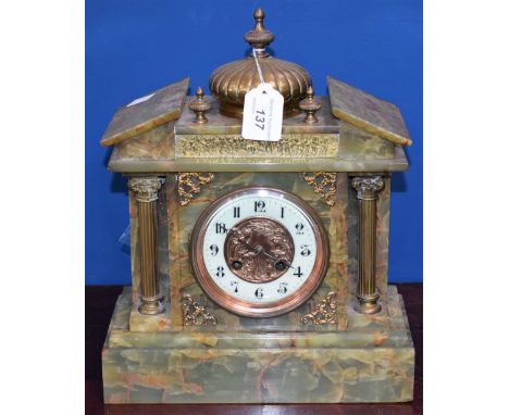 A green onyx early 20th century mantel clock, classical frieze to face, Arabic numerals, twin winding holes, brass dome and c