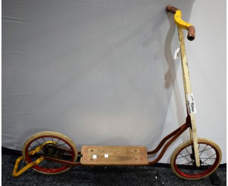 A vintage Tri-ang 1950's scooter, multi colour red, white and yellow metal frame, wooden foot plate, spoked wheels, c.1955