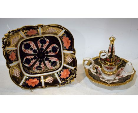 A Royal Crown Derby 1128 pattern footed acorn dish, first quality; an 1128 Old Imari pattern chamber stick and snuffer, first