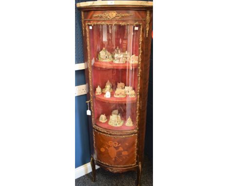 A Louis XVI Revival 'gilt' metal mounted corner vitrine/display cabinet, marble top above a three-quarter glazed door enclosi