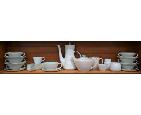 Poole pottery twintone including coffee pot, teapot, two handled soup bowls on saucers, crescent shaped side dishes; etc