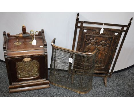 A Victorian mahogany purdonium/coal scuttle; a wrought and pressed metal firescreen; another (3)