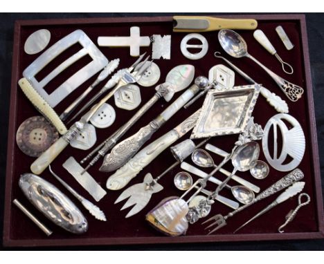 Mother of pearl and silver items, including a silver fruit knife, buckles, button hook, pin tray, propelling pencil with bloo