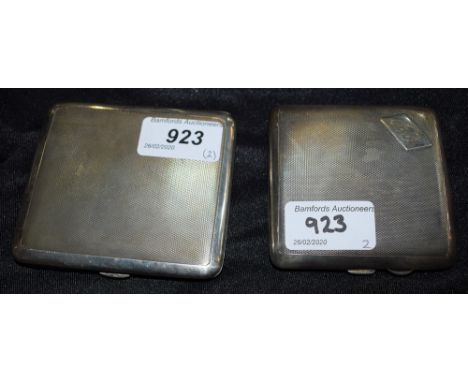 A silver cigarette case, engine turned decoration, London hallmarks, approx 95g; another similar, shaped, approx 88g (2)