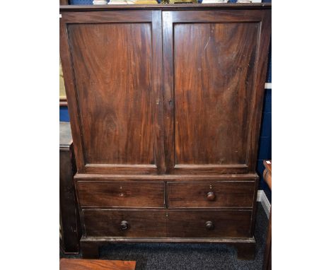 A George III mahogany 'linen press', moulded rectangular top above a pair of panel doors enclosing a vacant interior, the bas