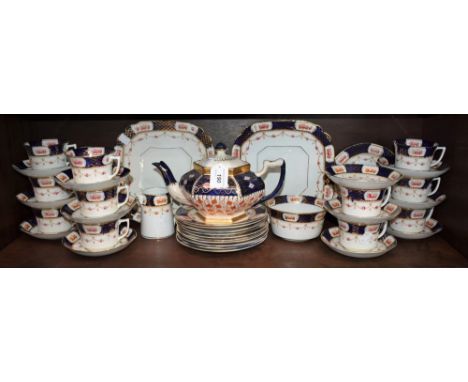 An early 20th century Warwick tea service, blue band picked out in gilt, comprising tea cups, saucers, sugar bowl, milk jug, 