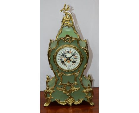 A Louis XV style mantel clock, painted enamel dial, Roman numerals, twin winding holes, gilt metal mounted, 38cm high
