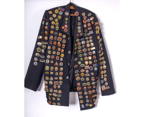 A BR blue cloth jacket  decorated with a collection of ASLEF and Railway related enamel badges.