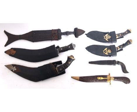 Two kukri knives in scabbards, together with a group of five other various knives (7).